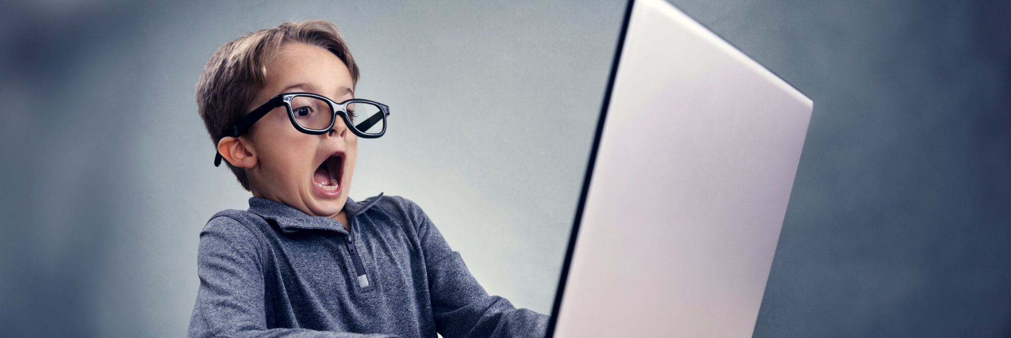 Student looking his IBDP Business mistakes at a laptop screen.