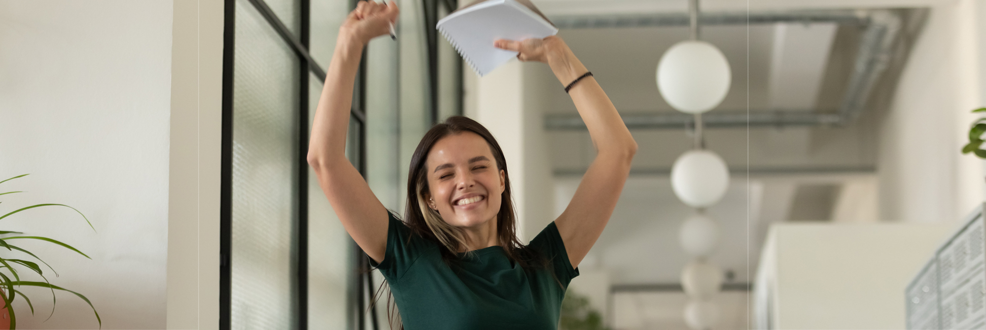 Happy student celebrating passing the IBDP Internal Assesment.