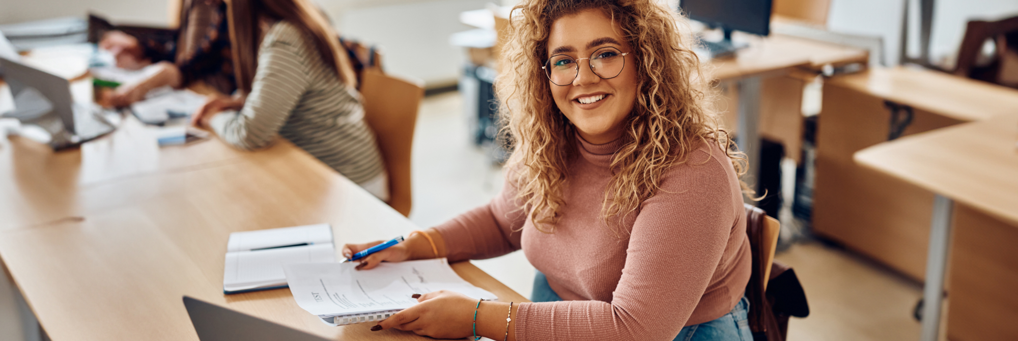  A happy student looking at her good grades in the IBDP exam.